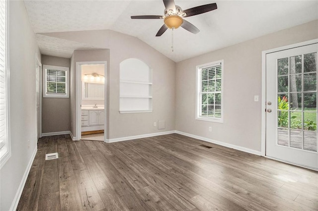 3321 Georgian Woods Cir, Decatur, GA 30034 - unfurnished room with wood finished floors, lofted ceiling, a ceiling fan, and built in features