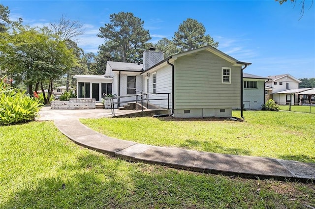 3321 Georgian Woods Cir, Decatur, GA 30034 - rear view of house featuring crawl space, a sunroom, a chimney, a yard, and a patio