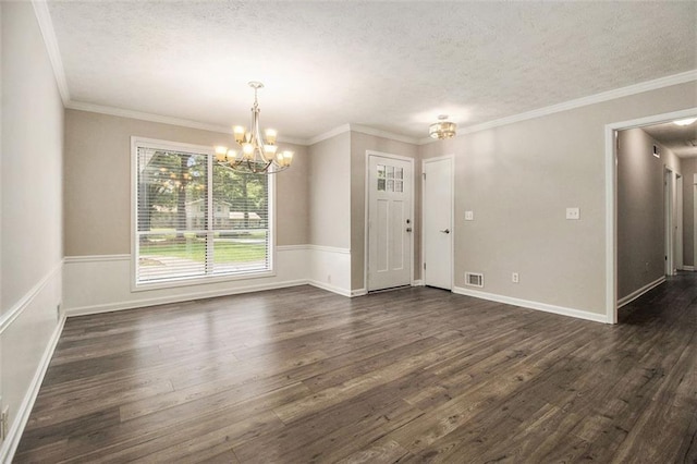 3321 Georgian Woods Cir, Decatur, GA 30034 - unfurnished dining area with a textured ceiling, a chandelier, dark wood-type flooring, and ornamental molding