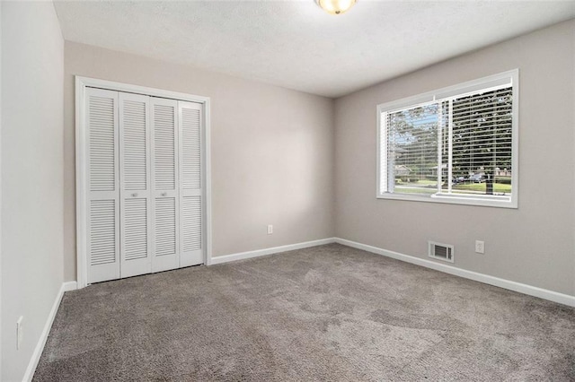 3321 Georgian Woods Cir, Decatur, GA 30034 - unfurnished bedroom featuring carpet and a closet