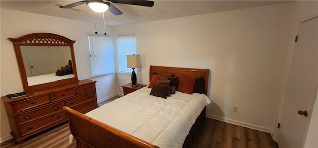 bedroom featuring dark hardwood / wood-style floors and ceiling fan