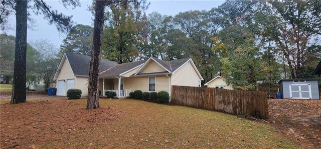 view of front of house featuring covered porch and a garage