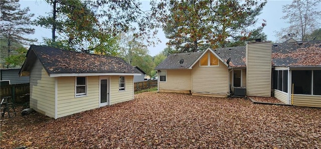 rear view of house with central AC