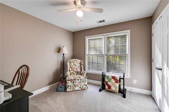 living area featuring carpet, visible vents, and baseboards