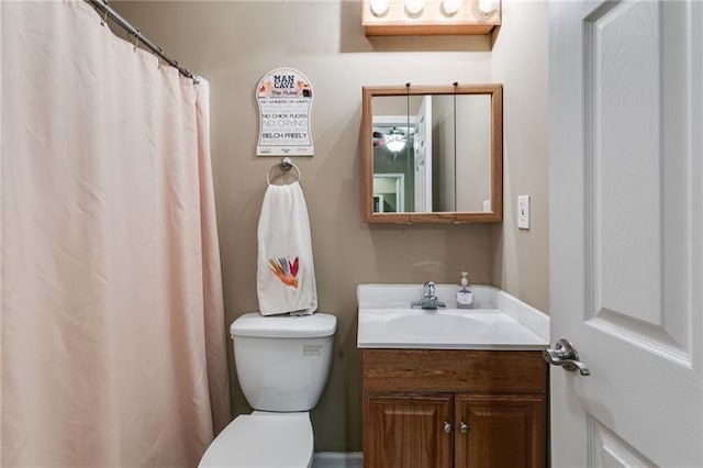 bathroom featuring toilet and vanity