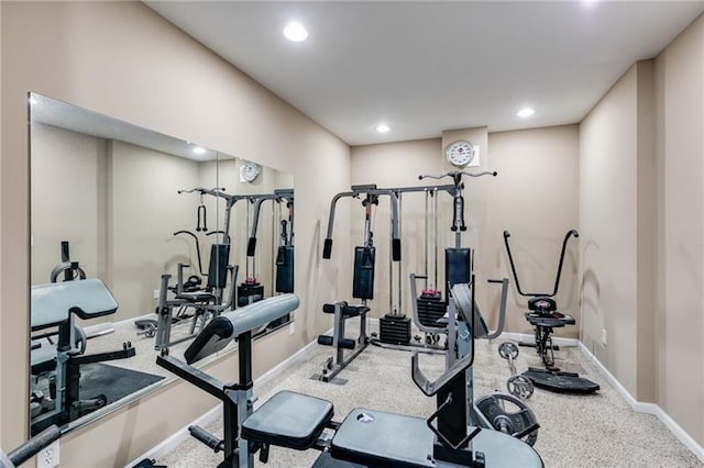 workout area featuring baseboards and recessed lighting