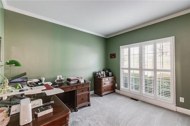 office space featuring light carpet, ornamental molding, visible vents, and baseboards