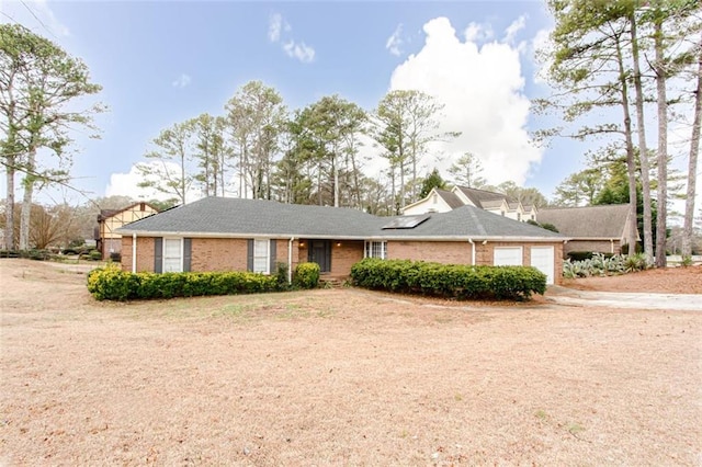 ranch-style house featuring a garage