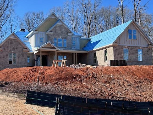 craftsman house with brick siding