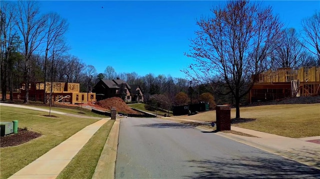 view of road with curbs and sidewalks