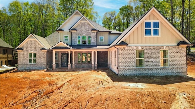 4563 Fawn Path, Gainesville, GA 30506 - craftsman-style house with board and batten siding, brick siding, and a porch