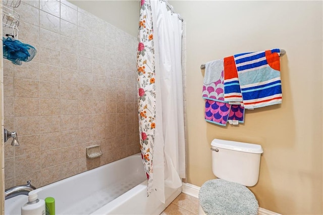 bathroom featuring shower / bath combination with curtain, baseboards, tile patterned flooring, and toilet