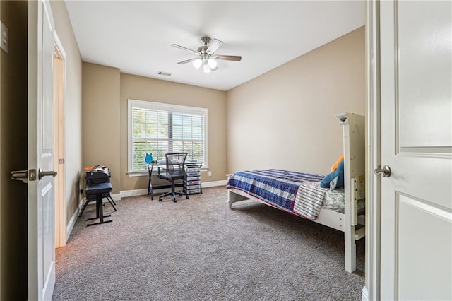 bedroom with ceiling fan, baseboards, visible vents, and carpet