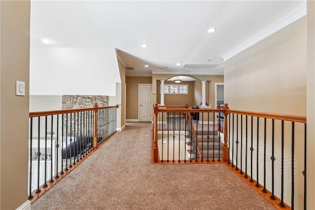hall featuring decorative columns, baseboards, recessed lighting, and ornamental molding