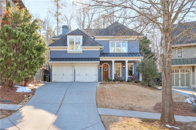 view of front of home with a porch and a garage