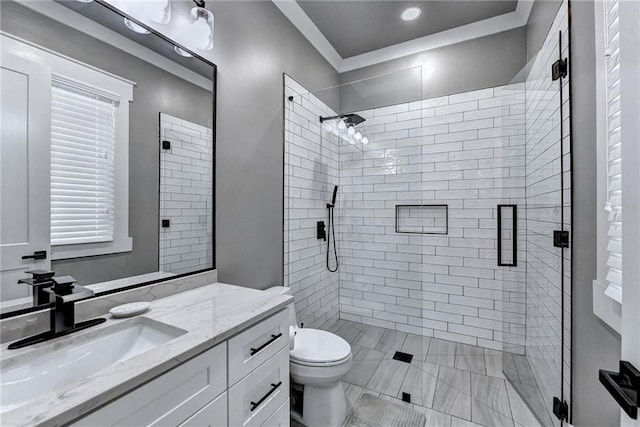 bathroom with an enclosed shower, toilet, and large vanity