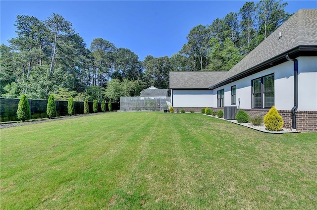 view of yard with central AC