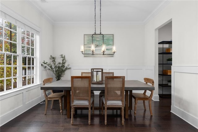 dining room featuring a chandelier, crown molding, and dark hardwood / wood-style floors