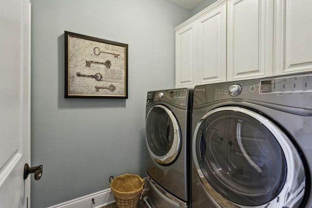 washroom with cabinets and independent washer and dryer