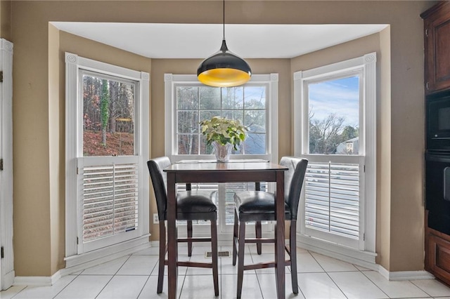 dining room featuring light tile patterned flooring