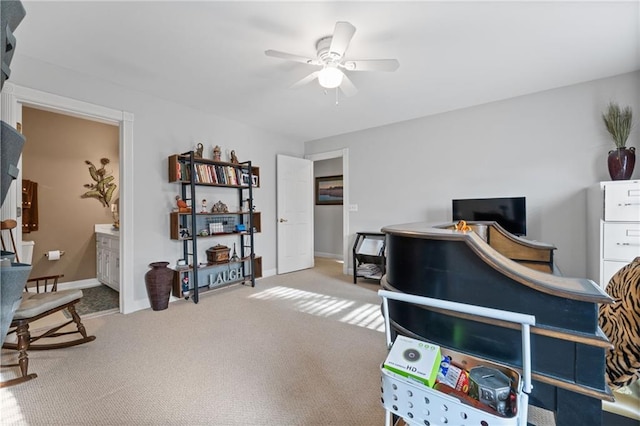 bedroom with ceiling fan, ensuite bath, and carpet