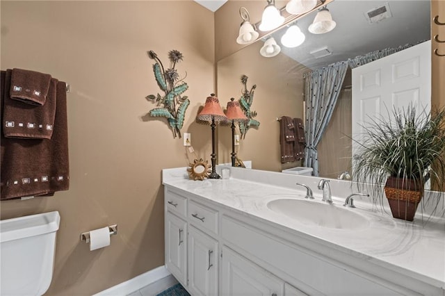 bathroom with vanity and toilet