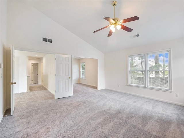 3515 Mcclure Woods Dr, Duluth, GA 30096 - empty room featuring light carpet, high vaulted ceiling, and ceiling fan