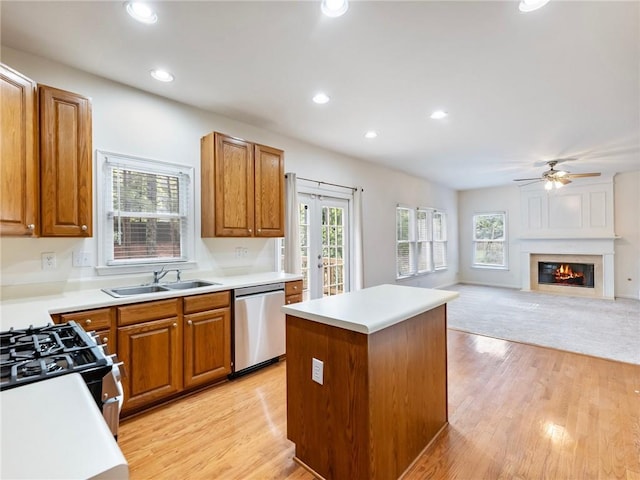 3515 Mcclure Woods Dr, Duluth, GA 30096 - kitchen featuring dishwasher, a center island, light wood-style floors, ceiling fan, and recessed lighting