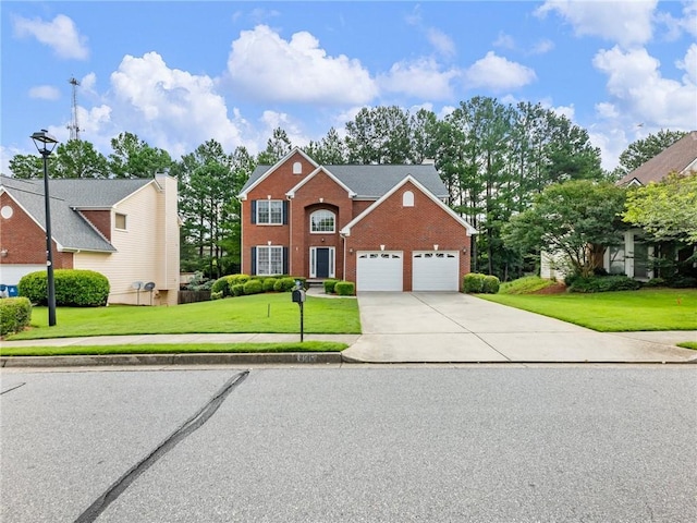 3515 Mcclure Woods Dr, Duluth, GA 30096 - view of front of property with brick siding, concrete driveway, a front yard, and an attached garage