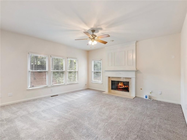 3515 Mcclure Woods Dr, Duluth, GA 30096 - unfurnished living room featuring ceiling fan, light colored carpet, and a large fireplace