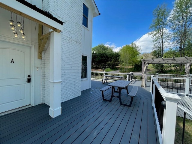 wooden deck featuring a pergola