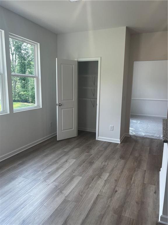 280 River Run Dr, Dallas, GA 30132 - unfurnished bedroom featuring dark wood-type flooring, a closet, and baseboards