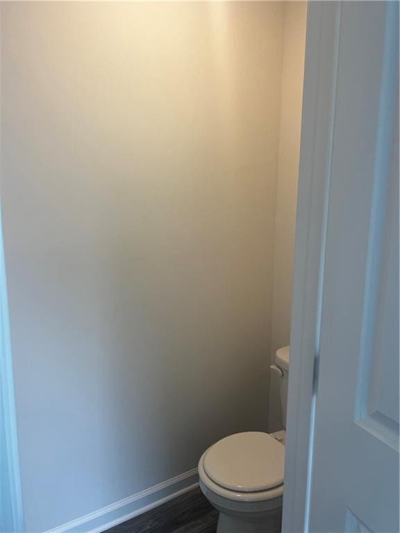 280 River Run Dr, Dallas, GA 30132 - bathroom with toilet, baseboards, and wood finished floors