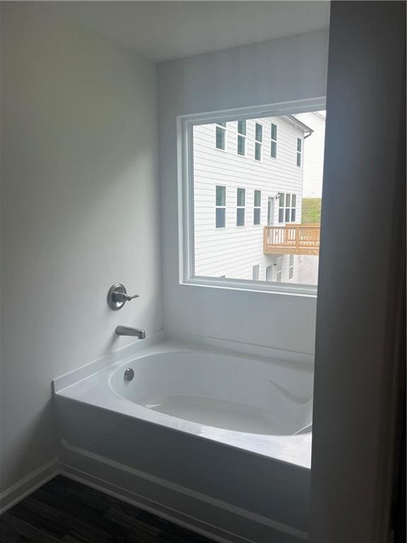 280 River Run Dr, Dallas, GA 30132 - full bathroom featuring a garden tub and wood finished floors