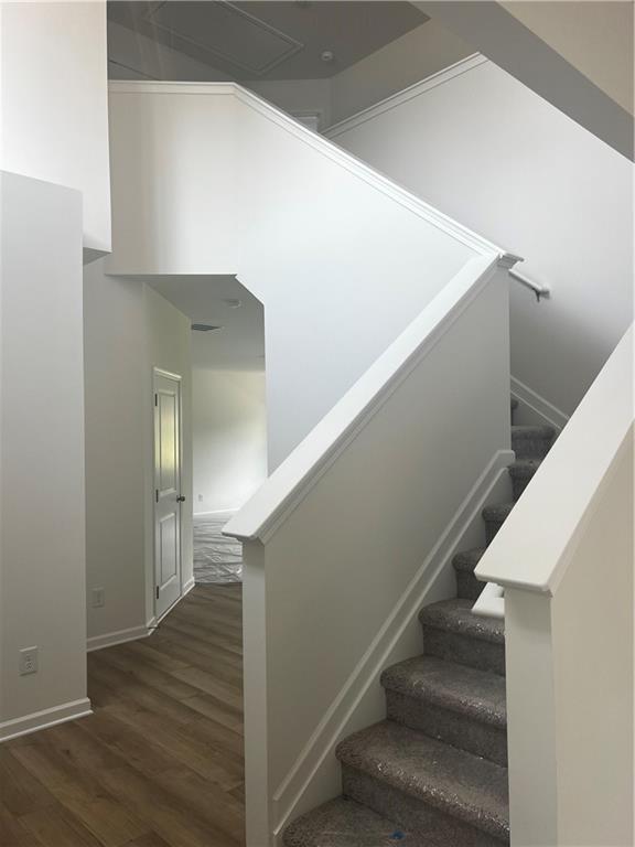 280 River Run Dr, Dallas, GA 30132 - stairs with wood finished floors and baseboards