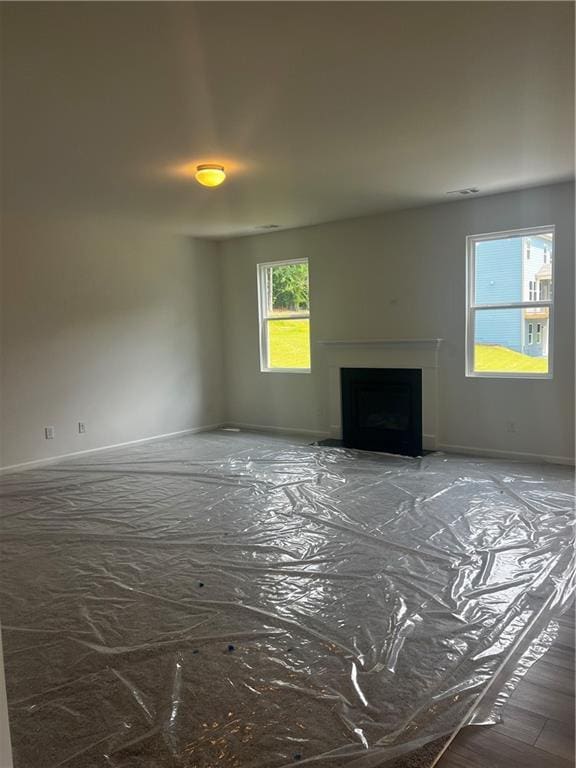 280 River Run Dr, Dallas, GA 30132 - unfurnished living room with a fireplace and baseboards