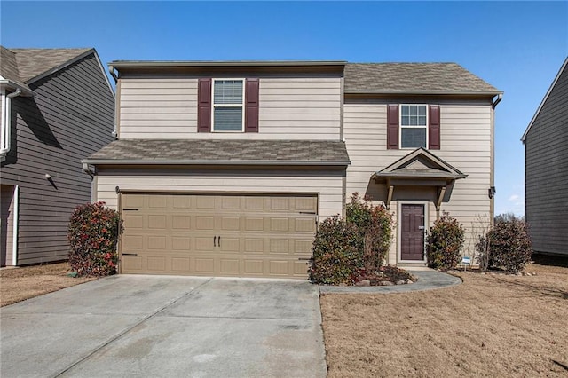 view of front of property with a garage