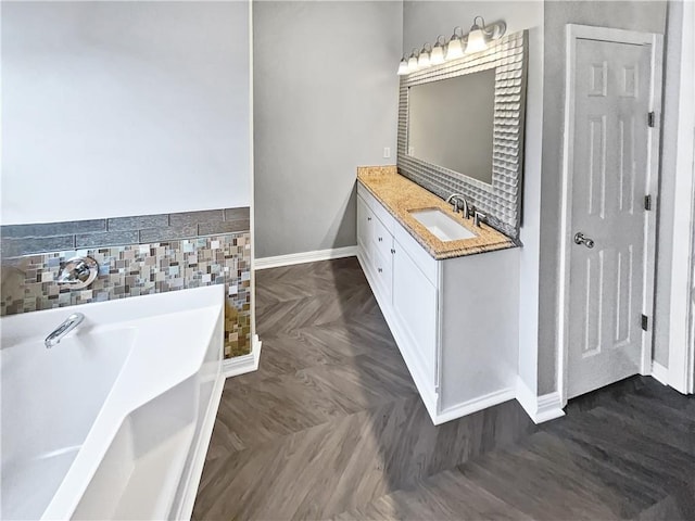 bathroom with vanity and a bathtub