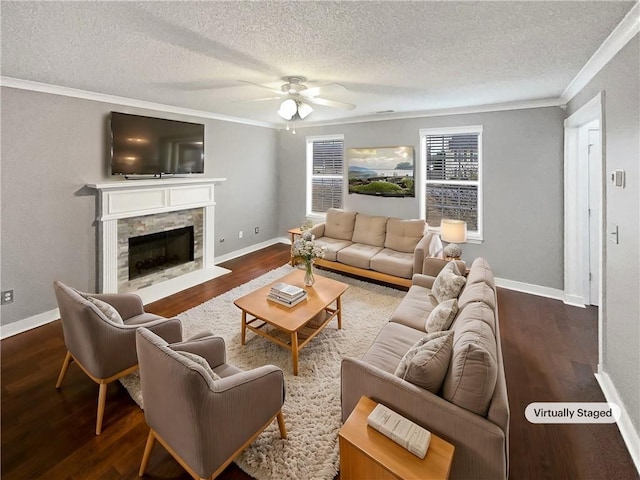 living room featuring a fireplace, ceiling fan, dark hardwood / wood-style flooring, and a textured ceiling