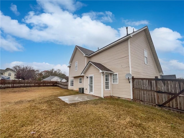 back of property featuring a patio area, central air condition unit, and a yard