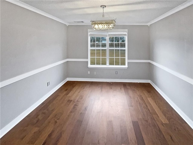 unfurnished dining area with a textured ceiling, a notable chandelier, dark hardwood / wood-style floors, and crown molding