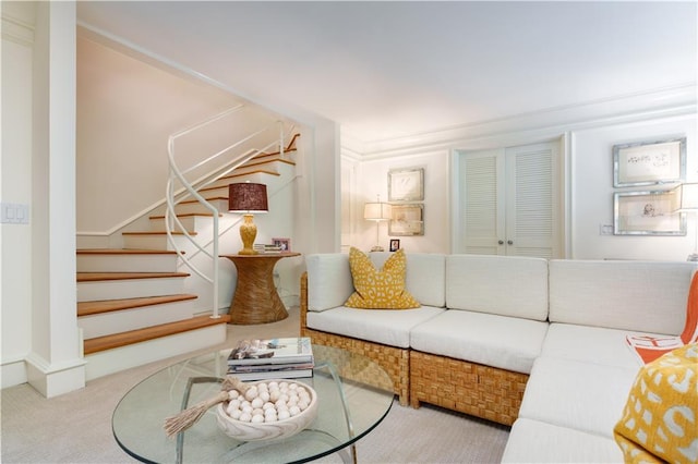 living room with light colored carpet and crown molding