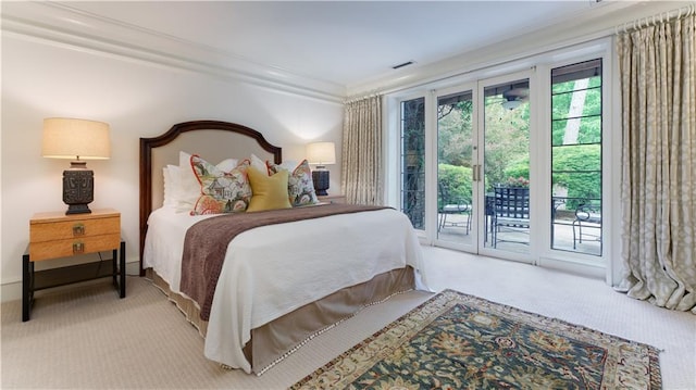 bedroom featuring access to exterior, ornamental molding, and light carpet