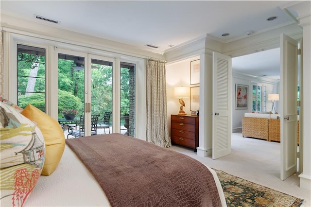 bedroom featuring access to exterior, light colored carpet, and ornamental molding