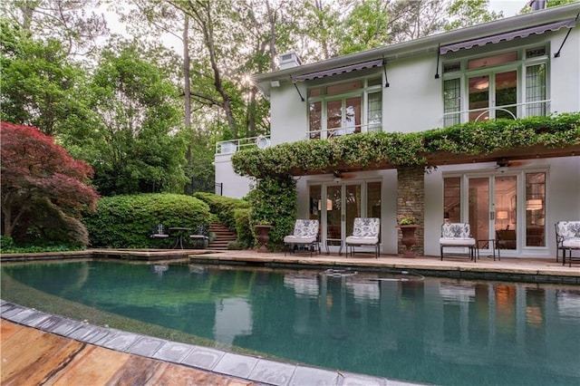 rear view of property featuring french doors and a patio