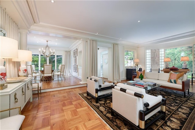 living room featuring a chandelier, light parquet flooring, and ornamental molding