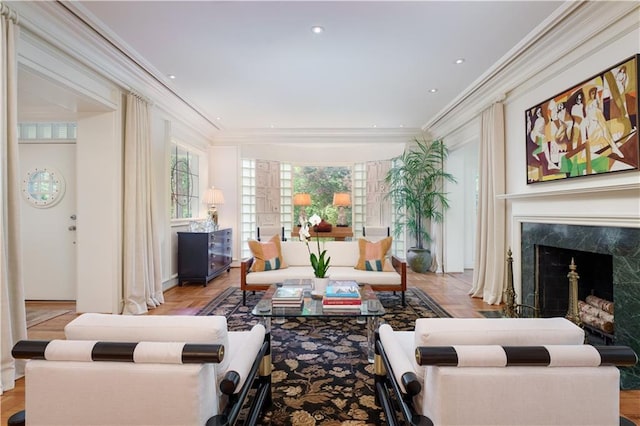 interior space with crown molding, a fireplace, and light parquet flooring