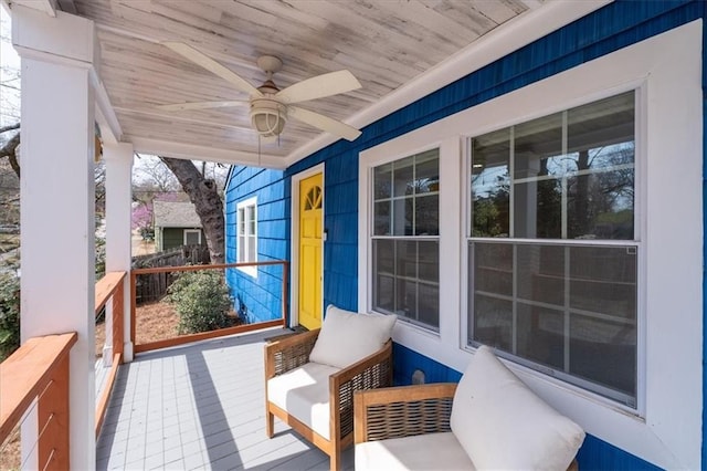 view of patio with a porch and a ceiling fan