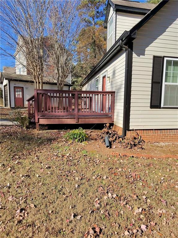 view of side of home with a deck