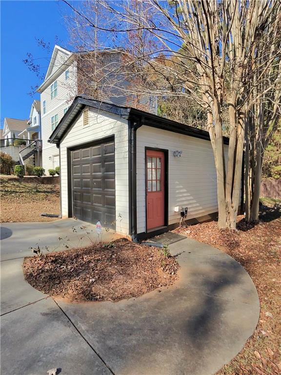 back of property with cooling unit and a yard